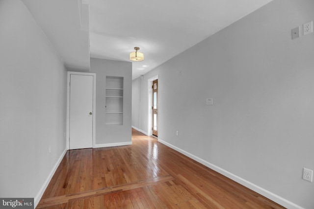 605 S Washington St, Baltimore, MD 21231 - unfurnished bedroom featuring hardwood / wood-style flooring and baseboards