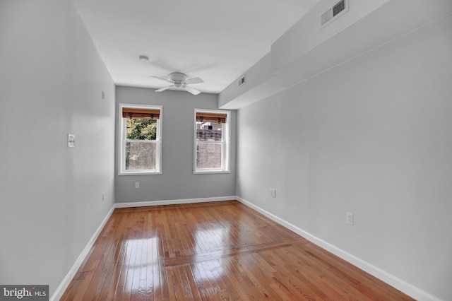 605 S Washington St, Baltimore, MD 21231 - empty room with wood-type flooring, a ceiling fan, and baseboards