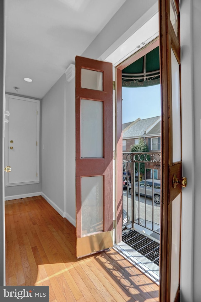 605 S Washington St, Baltimore, MD 21231 - doorway to outside with wood finished floors, baseboards, and recessed lighting