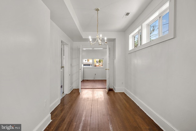 560 25th Pl NE, Washington, DC 20002 - interior space with visible vents, dark wood finished floors, baseboards, and a chandelier