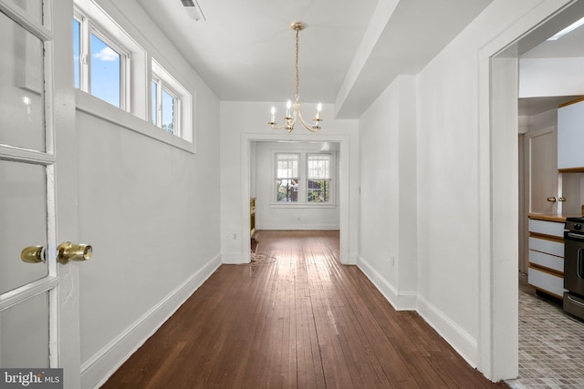 560 25th Pl NE, Washington, DC 20002 - interior space featuring baseboards, visible vents, dark wood finished floors, and a chandelier