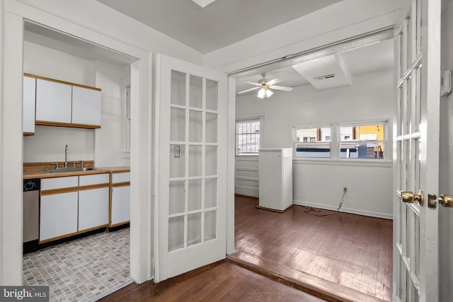 560 25th Pl NE, Washington, DC 20002 - doorway to outside featuring visible vents, a ceiling fan, baseboards, hardwood / wood-style flooring, and a sink