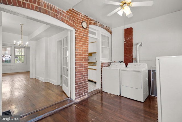 560 25th Pl NE, Washington, DC 20002 - laundry area featuring laundry area, dark wood-style floors, washing machine and dryer, and ceiling fan with notable chandelier