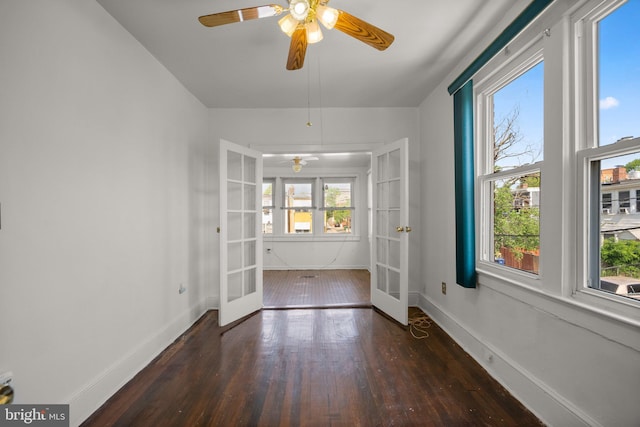 560 25th Pl NE, Washington, DC 20002 - unfurnished dining area with baseboards, ceiling fan, wood-type flooring, and french doors