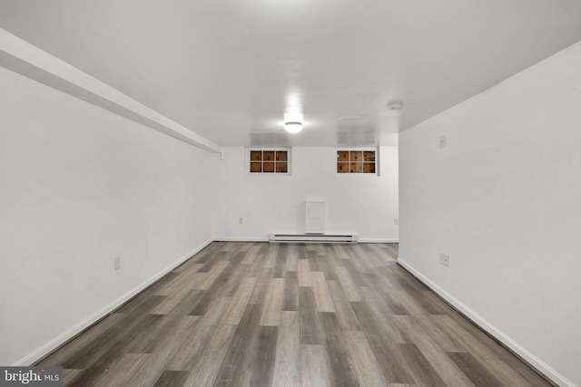 560 25th Pl NE, Washington, DC 20002 - finished below grade area featuring baseboards, wood finished floors, and baseboard heating