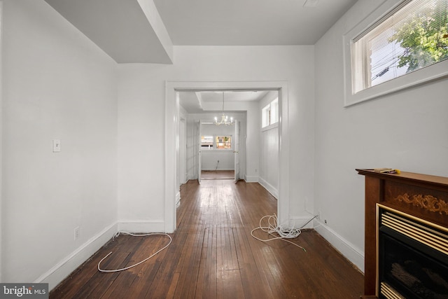 560 25th Pl NE, Washington, DC 20002 - corridor with an inviting chandelier, baseboards, and wood-type flooring