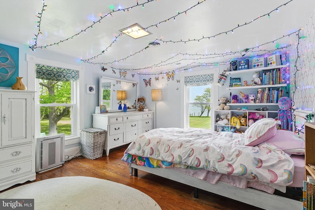 bedroom featuring hardwood / wood-style flooring and access to outside