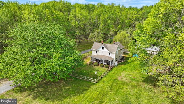 drone / aerial view featuring a forest view