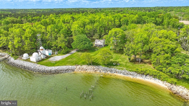 bird's eye view featuring a water view and a wooded view