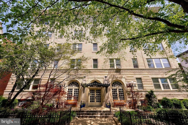 view of building exterior featuring a fenced front yard