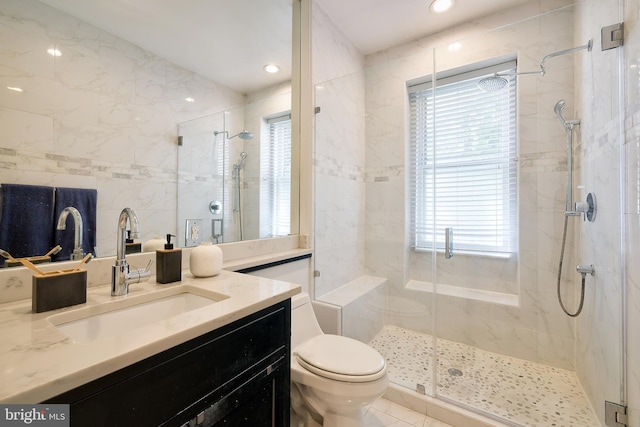 full bath featuring toilet, a shower stall, and a healthy amount of sunlight