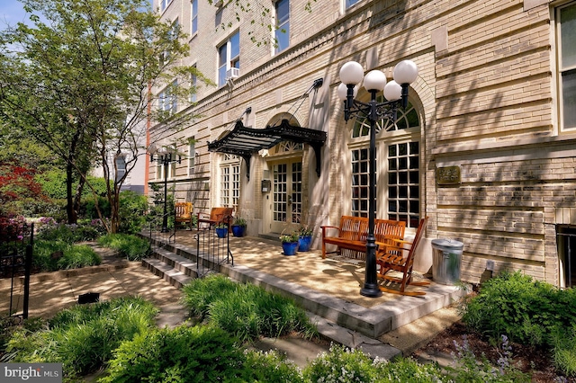 entrance to property with a patio area