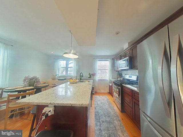 2710 N 47th St, Philadelphia, PA 19131 - kitchen featuring stainless steel appliances, a sink, decorative backsplash, a center island, and recessed lighting