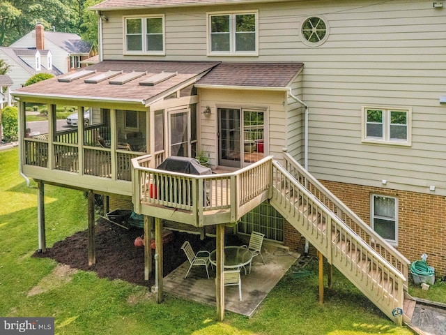 608 Silverstone Ct, Silver Spring, MD 20905 - back of property featuring a shingled roof, a sunroom, stairs, a yard, and a deck