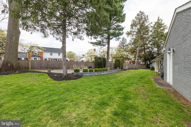 view of yard with a fenced backyard