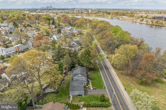 bird's eye view featuring a water view and a residential view