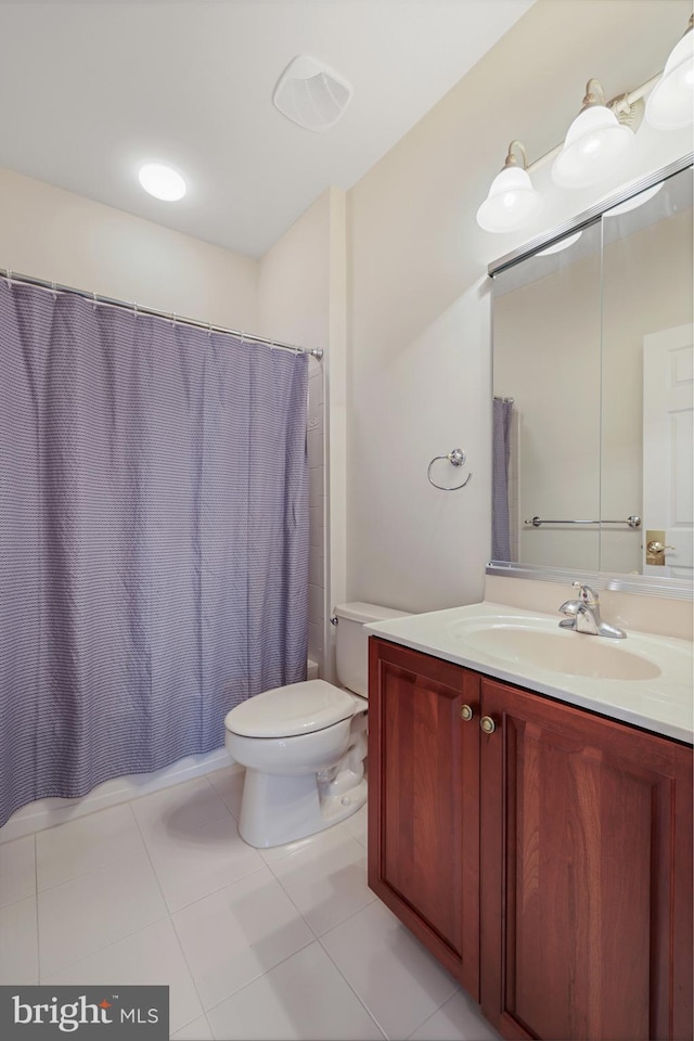 bathroom with toilet, tile patterned floors, a shower with shower curtain, and vanity