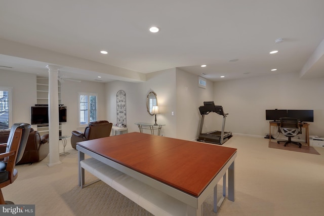 dining area featuring recessed lighting, decorative columns, and light carpet