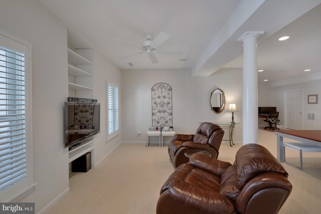 carpeted living room featuring baseboards, decorative columns, a ceiling fan, and recessed lighting
