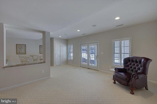 unfurnished room with carpet floors, baseboards, and visible vents