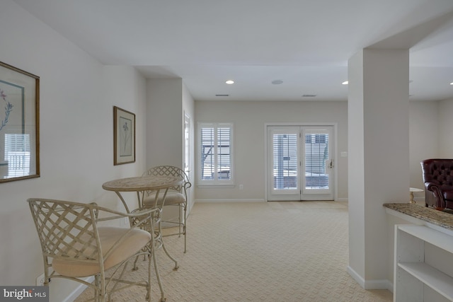 carpeted dining space with baseboards and recessed lighting