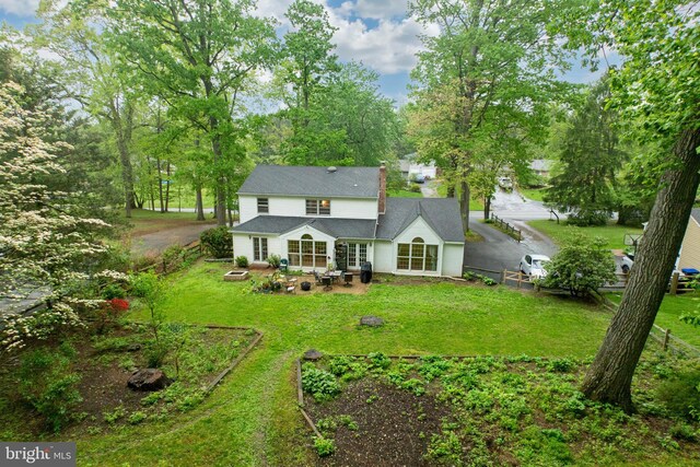 304 King Rd, West Chester, PA 19380 - rear view of house with a lawn, a patio, a fire pit, and fence