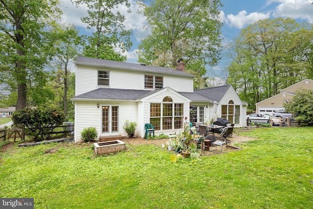 304 King Rd, West Chester, PA 19380 - back of house featuring a patio, a chimney, fence, a yard, and roof with shingles