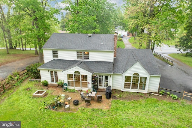 304 King Rd, West Chester, PA 19380 - back of house with a yard, a chimney, a vegetable garden, french doors, and a patio area