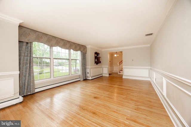 304 King Rd, West Chester, PA 19380 - unfurnished living room featuring ornamental molding, visible vents, a baseboard radiator, light wood-style flooring, and a notable chandelier