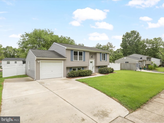 bi-level home featuring driveway and a garage