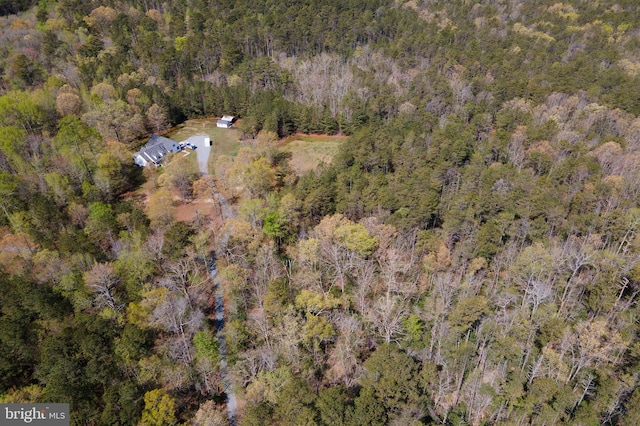 drone / aerial view featuring a view of trees