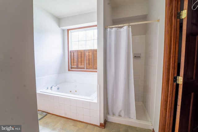 full bath featuring a jetted tub and a stall shower