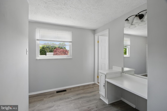 5694 Singletree Dr, Frederick, MD 21703 - unfurnished office with a textured ceiling, wood finished floors, and baseboards
