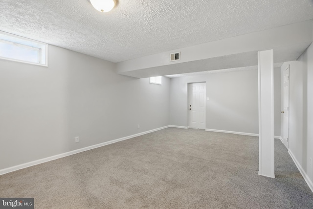 5694 Singletree Dr, Frederick, MD 21703 - below grade area featuring carpet floors, a textured ceiling, and baseboards
