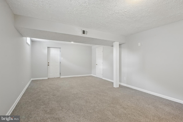 5694 Singletree Dr, Frederick, MD 21703 - finished below grade area featuring carpet, a textured ceiling, and baseboards