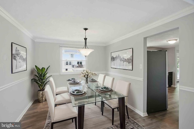 5694 Singletree Dr, Frederick, MD 21703 - dining space with wood finished floors, ornamental molding, and baseboards