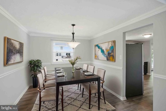 5694 Singletree Dr, Frederick, MD 21703 - dining area with wood finished floors, crown molding, and baseboards