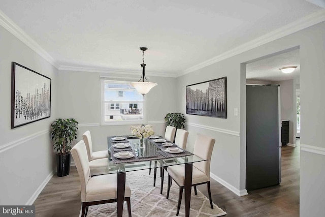 5694 Singletree Dr, Frederick, MD 21703 - dining space featuring wood finished floors, crown molding, and baseboards