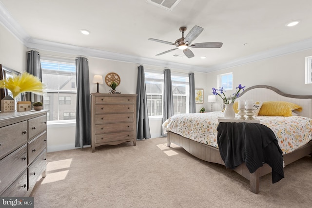 bedroom featuring multiple windows, light colored carpet, and crown molding
