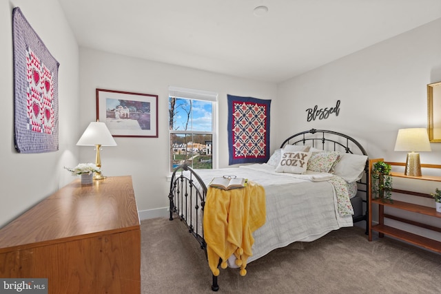 bedroom featuring carpet flooring and baseboards