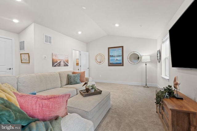 living area featuring lofted ceiling, baseboards, visible vents, and light colored carpet