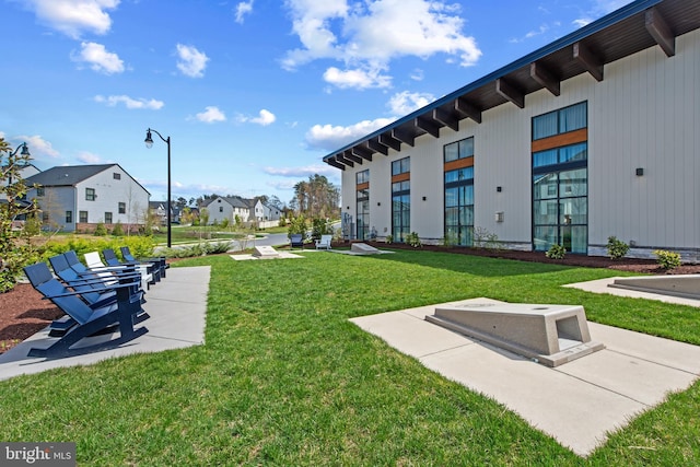 view of home's community with a yard and a residential view