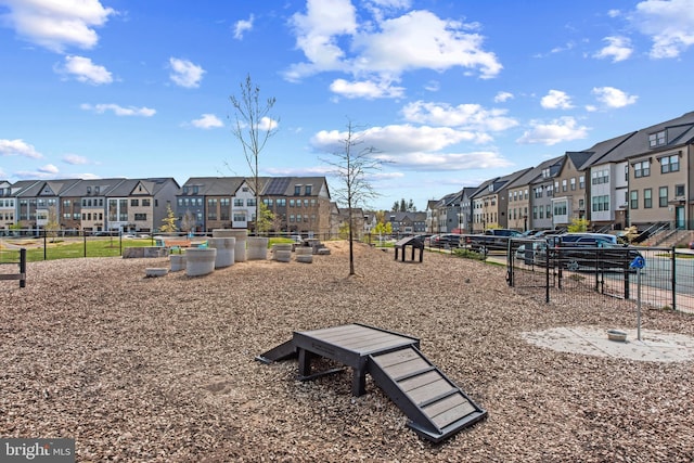 view of community featuring a residential view and fence