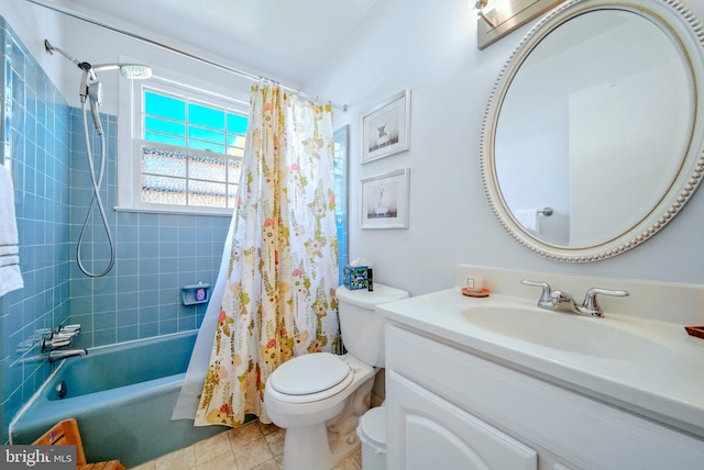 full bath featuring tile patterned floors, toilet, vanity, and shower / bath combination with curtain
