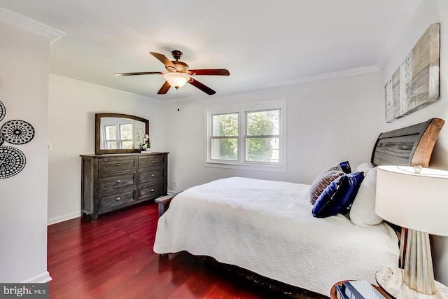 bedroom featuring ceiling fan, baseboards, ornamental molding, and wood finished floors