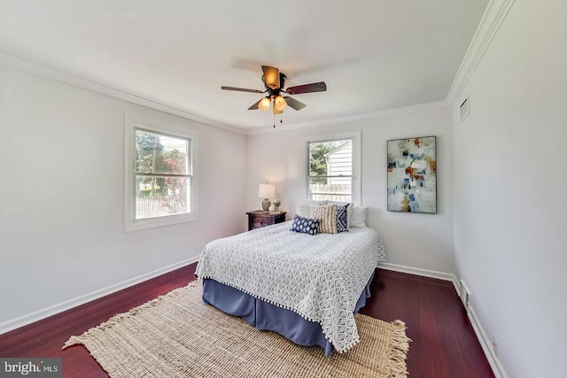 bedroom featuring baseboards, dark wood-style floors, visible vents, and ornamental molding