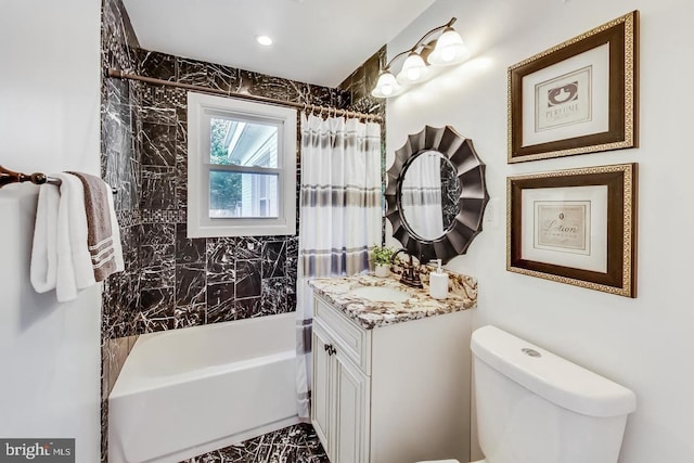 full bathroom featuring shower / bath combo with shower curtain, vanity, and toilet