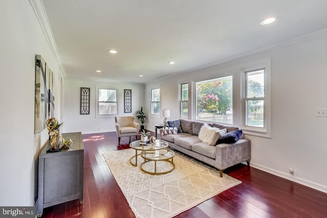 living area with recessed lighting, hardwood / wood-style floors, baseboards, and ornamental molding