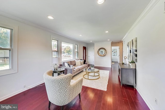 living area featuring crown molding, baseboards, dark wood-style floors, and recessed lighting
