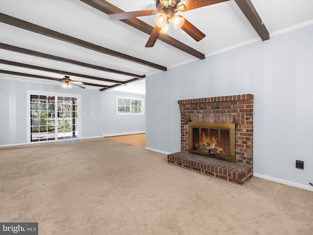 unfurnished living room featuring a brick fireplace, ceiling fan, carpet floors, beamed ceiling, and a baseboard heating unit